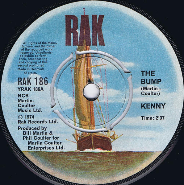 Kenny (3) : The Bump (7", Single, Yel)