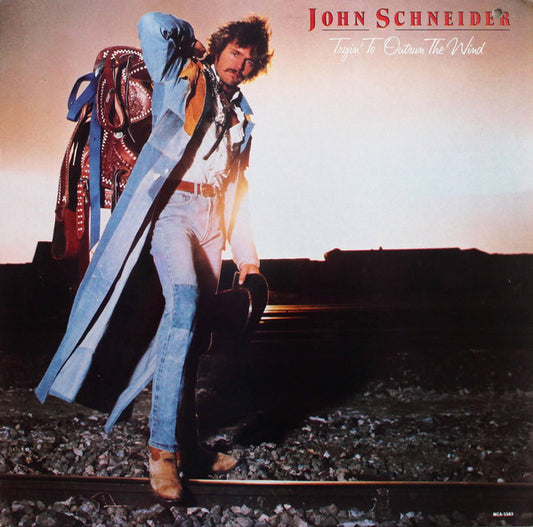 John Schneider : Tryin' To Outrun The Wind (LP, Album, Glo)