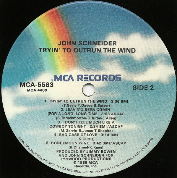 John Schneider : Tryin' To Outrun The Wind (LP, Album, Glo)